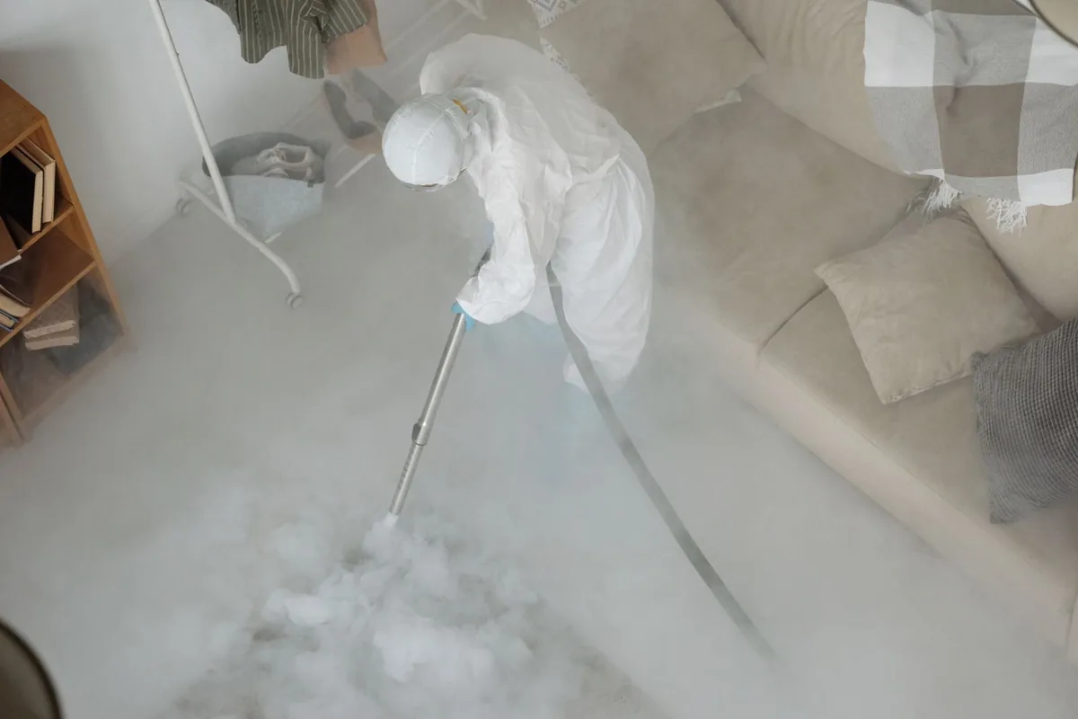 Biohazard cleanup technician in protective equipment, Saranac, MI